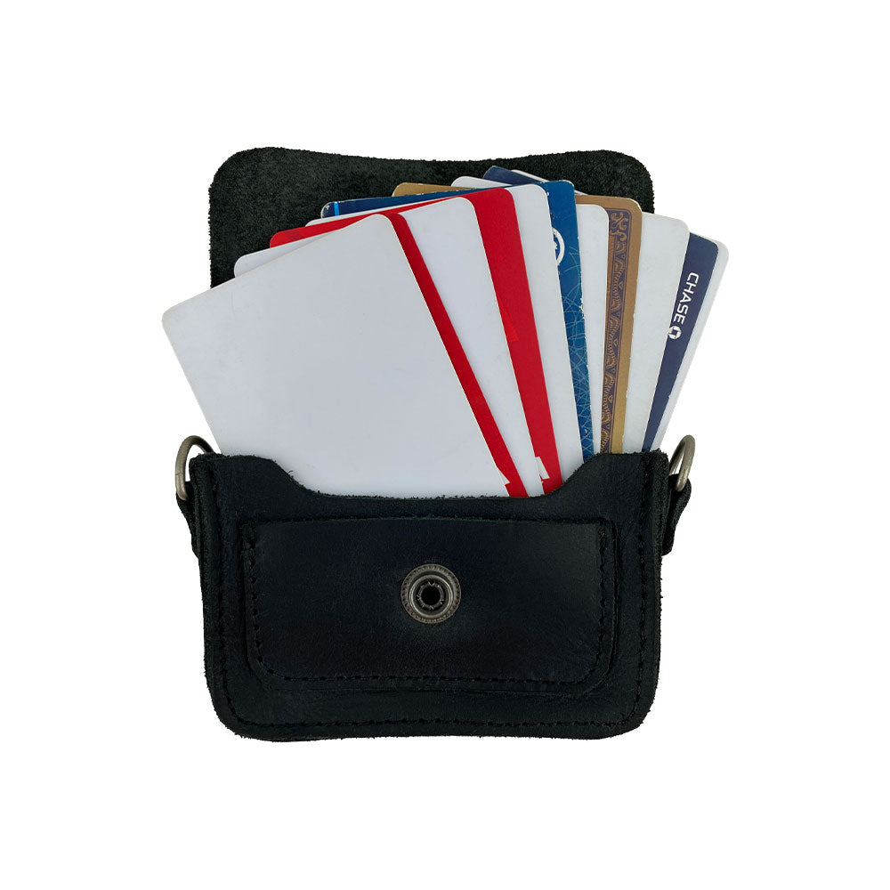 Hide & Drink's Card Holder Briefcase Style, featuring a Mini Briefcase Card Holder filled with a range of cards. This Full Grain Leather cash organizer holds up to 10 cards and folded bills, showcasing artisanal craftsmanship in small batch production.