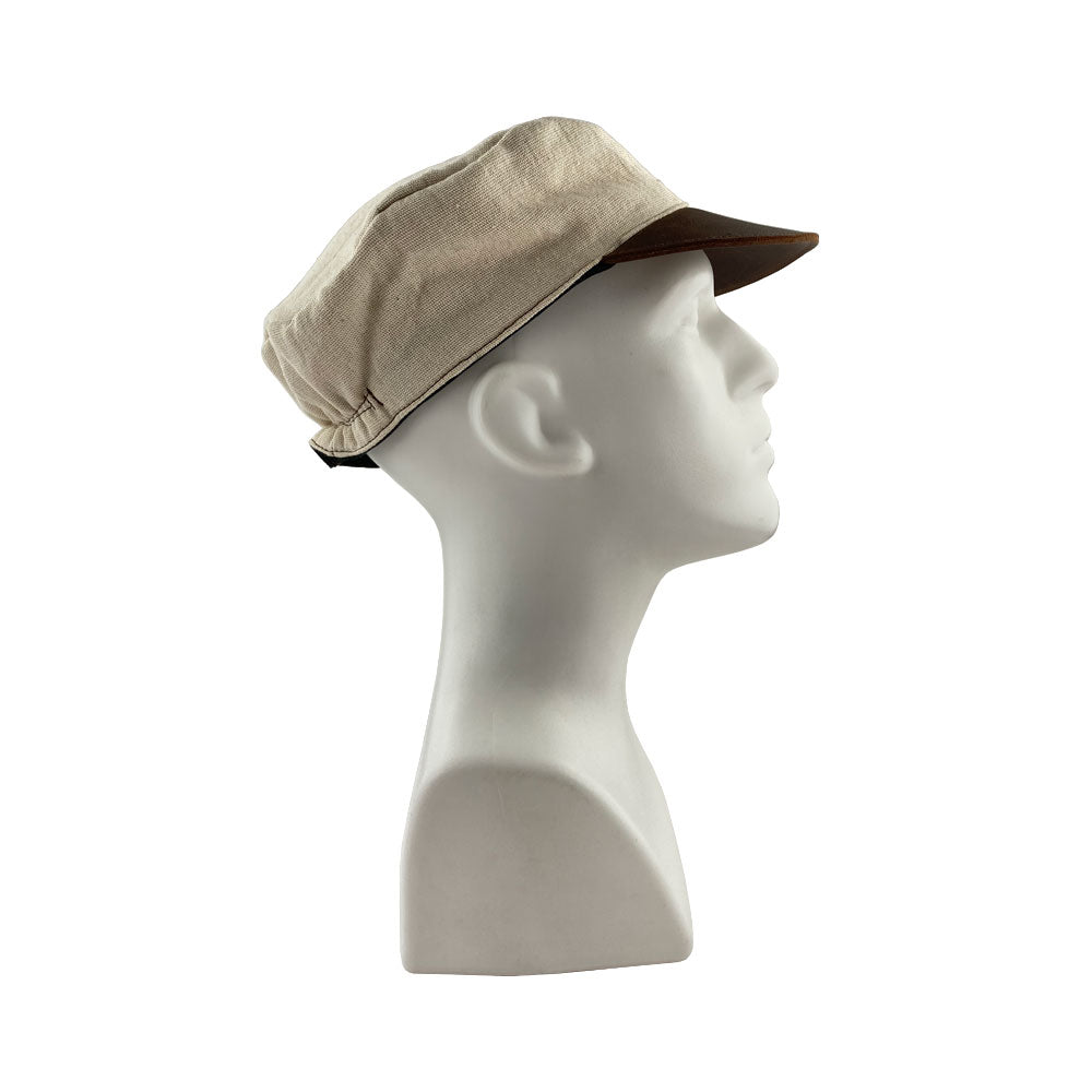 Profile view of the Manta Cotton Painter Cap from Hide & Drink, combining style and functionality with Full Grain Leather & Natural Manta Cotton, tailored for artisans. This Canvas Painter Cap is crafted through small batch production, hand cut, hand sewn, and fire branded, illustrating artisan heritage, handmade in La Antigua Guatemala & Oaxaca Mexico.