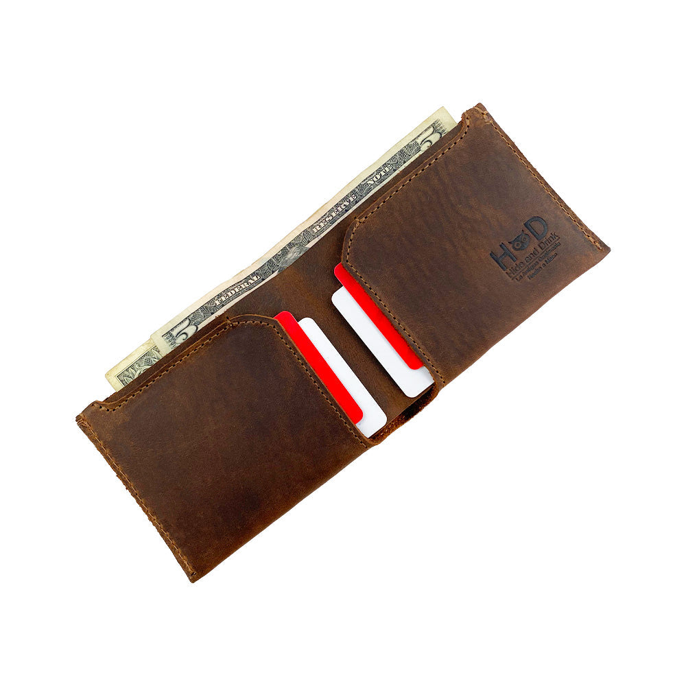 Hide & Drink Classic Wallet displaying cash and cards, perfect for organization on the go with a touch of artisan craftsmanship. Classic Wallet, Card Organizer, Money Holder, Vintage Pocket, Travel Accessories, Full Grain Leather, StockyardX, Small Batch Production, Hand Cut, Hand Sewn, Fire Branded, Artisan, Handmade in La Antigua Guatemala & Oaxaca Mexico.