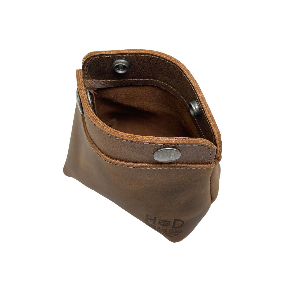 Interior view of the Hide & Drink Double Snap Pouch, designed as a functional coin purse and cash holder, made from full grain leather. Hand cut and sewn by artisans in La Antigua Guatemala, it's perfect for small items like cables or makeup.