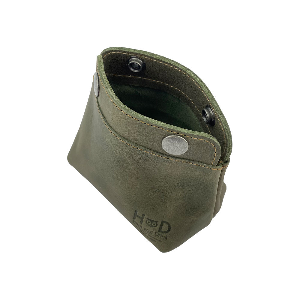 Interior look at the Hide & Drink Double Snap Pouch displaying its utility as a cash & card holder and makeup organizer. This durable full grain leather product is handmade in La Antigua Guatemala.