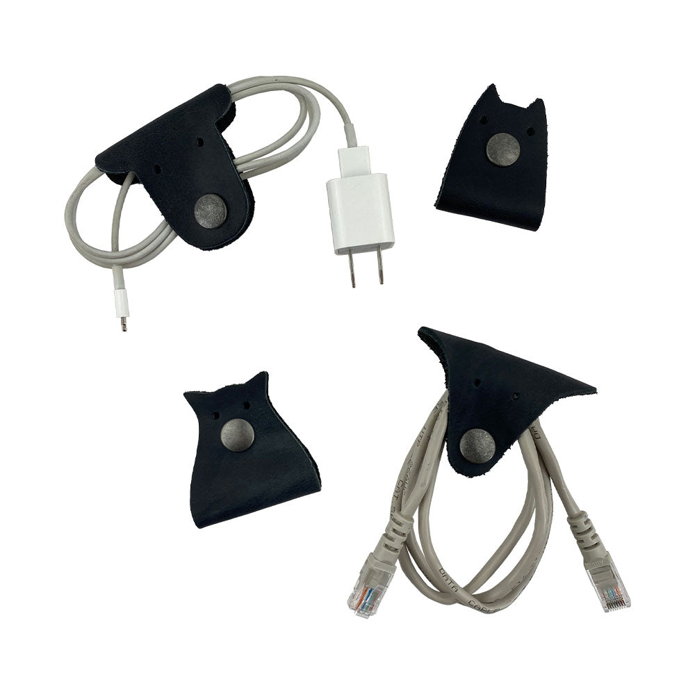 Furry Friends Cord Keeper (4-Pack) showcasing adorable designs for cord organization, made of durable full grain leather by Hide & Drink. Furry Friends 4-Pack Cord Keeper (Cord Clam), Full Grain Leather, StockyardX, Small Batch Production, Hand Cut, Hand Sewn, Fire Branded, Artisan, Handmade in La Antigua Guatemala & Oaxaca Mexico.