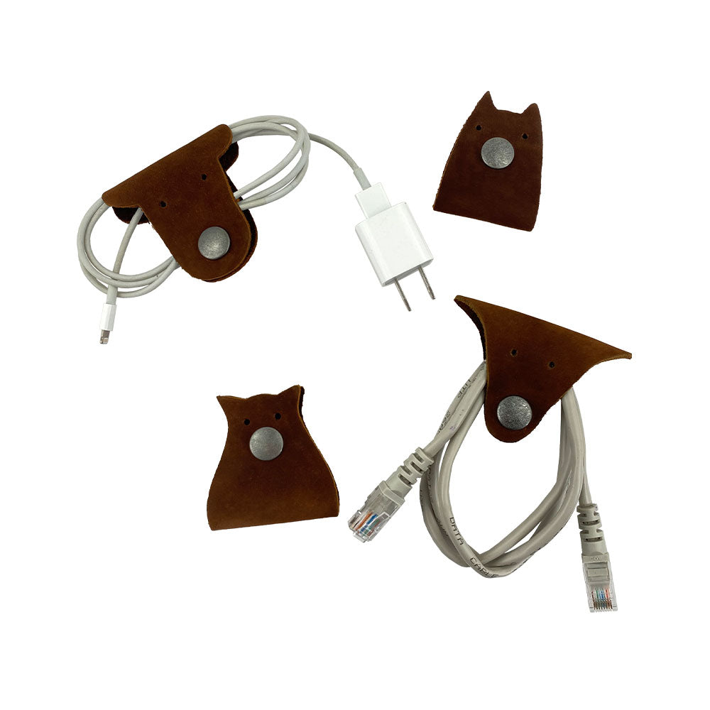 Furry Friends Cord Keeper (4-Pack), featuring unique animal designs, expertly crafted from Full Grain Leather by Hide & Drink, perfect for organizing your cords. Furry Friends 4-Pack Cord Keeper (Cord Clam), Full Grain Leather, StockyardX, Small Batch Production, Hand Cut, Hand Sewn, Fire Branded, Artisan, Handmade in La Antigua Guatemala & Oaxaca Mexico.