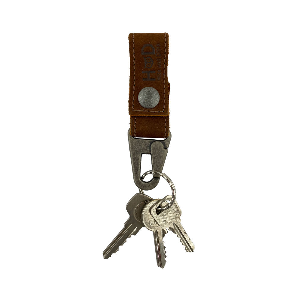 Stylish Key Ring Holder by Hide & Drink made from Full Grain Leather, featuring rustic metal snaps. This artisan piece is perfect for organizing keys and showcases Small Batch Production. Handmade in La Antigua Guatemala & Oaxaca Mexico.