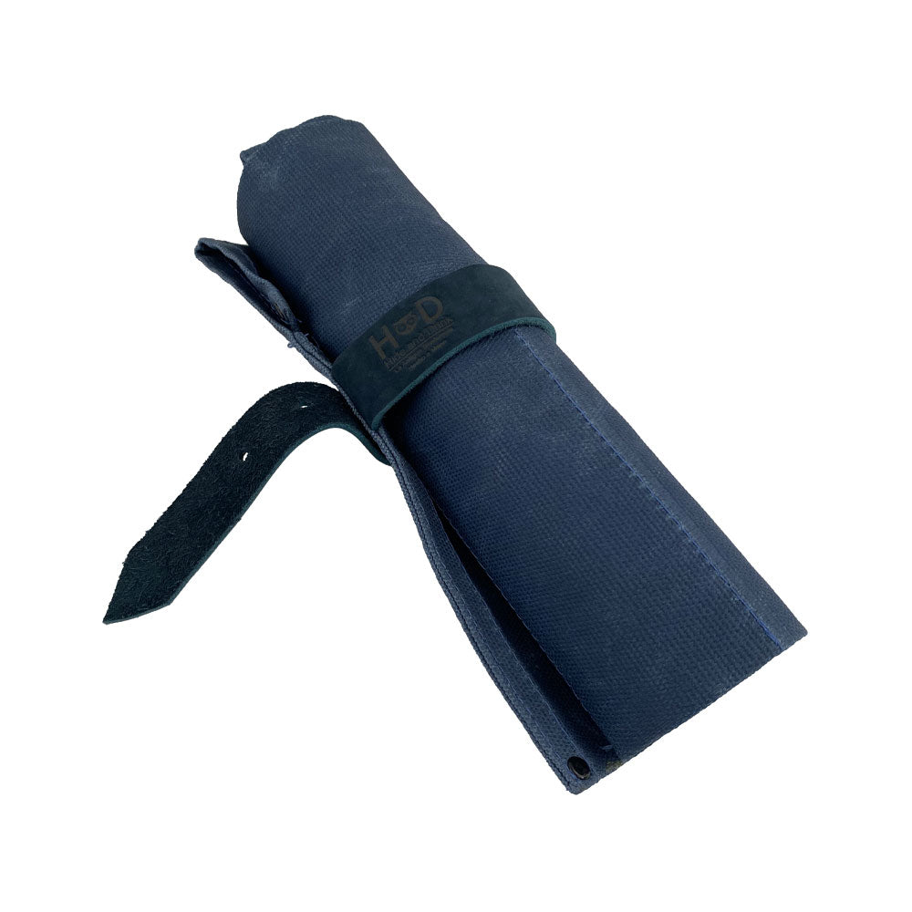 Hide & Drink's Large Tool Roll displayed with tools positioned in its slots. This Portable Carry-On Pouch features 6 expert spaces for woodworking tools organization. Made from durable waxed canvas and full grain leather variations, this artisan product highlights meticulous hand-cut and hand-sewn craftsmanship, handmade in La Antigua Guatemala & Oaxaca Mexico.
