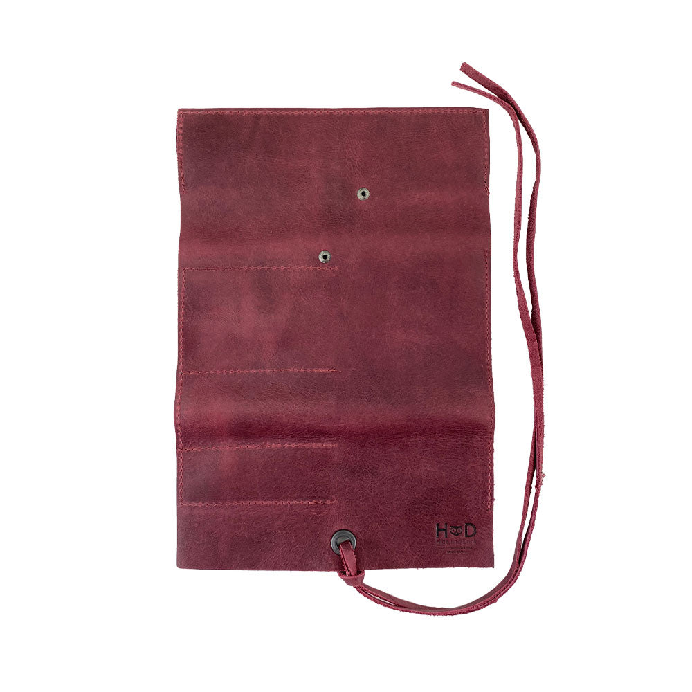 Hide & Drink Multi Purpose Pencil Roll in sleek black leather, showcasing its easy storage capabilities. This handmade organizer is perfect for work and craft supplies, representing artisan quality from La Antigua Guatemala & Oaxaca Mexico.