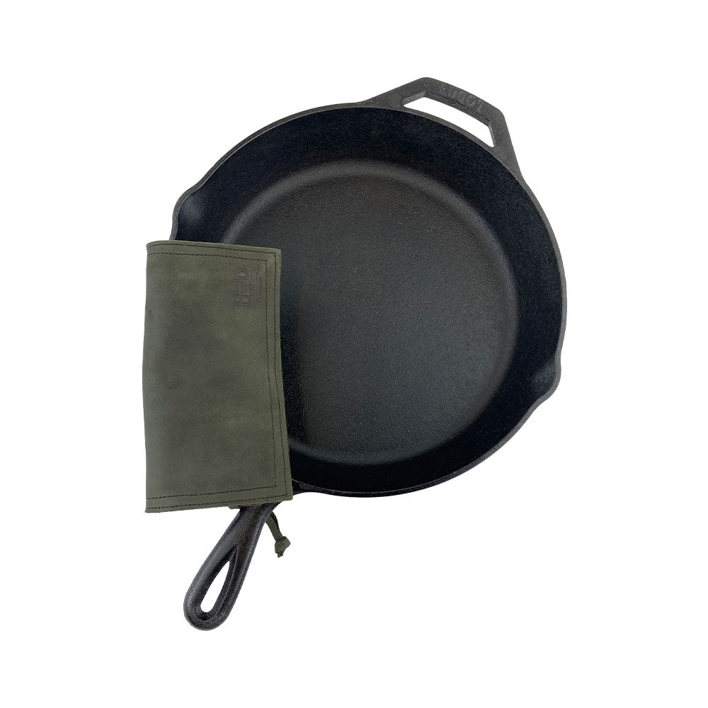 Hide & Drink Pot Pad featured alongside cookware, demonstrating its practicality and style as a hot pot pad. Artisan crafted from full grain leather.