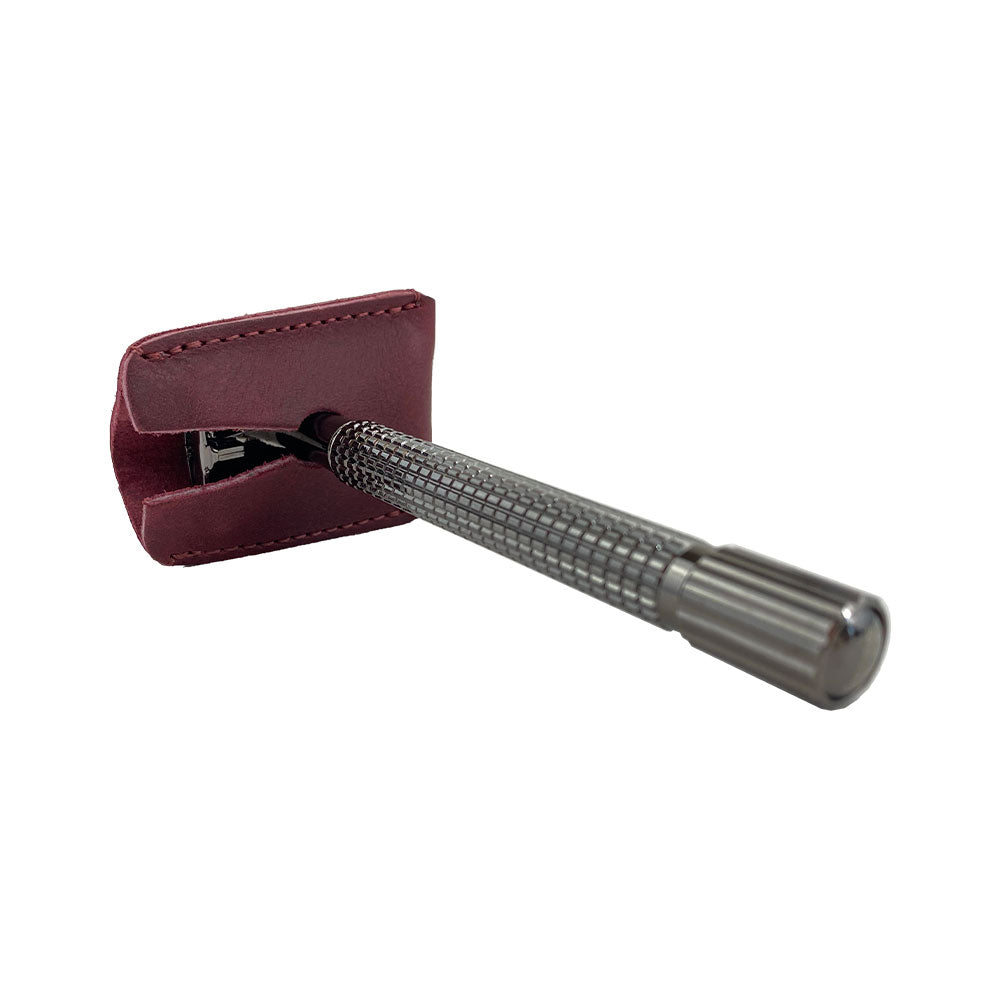 The side view of the Razor Head Cover by Hide & Drink, featuring its expertly constructed shape. This full grain leather shaving travel cover serves as a protective sheath for double edge safety razors, highlighting the artisan quality from La Antigua Guatemala.