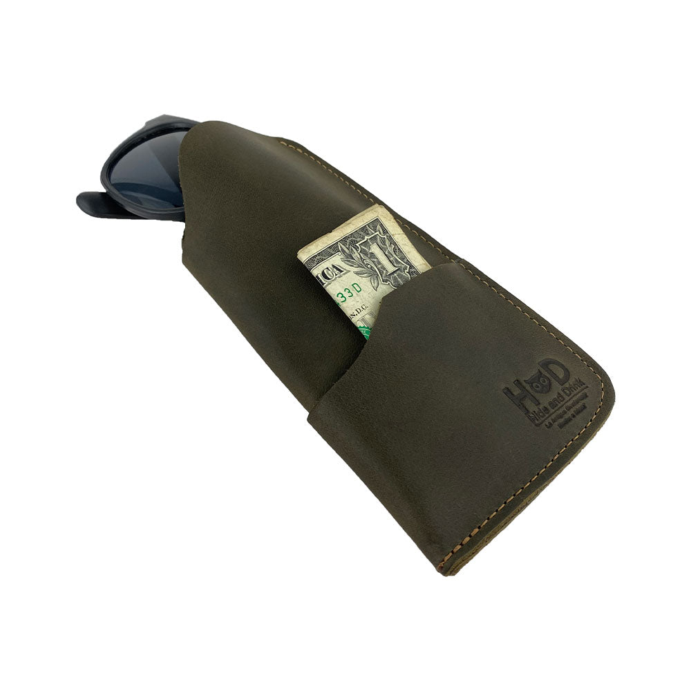 Showcase of the Hide & Drink Sunglass Case & Wallet in red leather, adding a pop of color to your style. This Rustic Sunglasses Case & Wallet features Full Grain Leather craftsmanship, making it an ideal glasses protector for travel, hand-cut and hand-sewn in La Antigua Guatemala & Oaxaca Mexico.