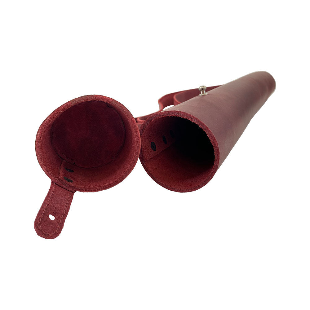 Hide & Drink's Blueprint Tube (A2 Paper Size) displayed with plans, capturing its practical use. This artisan-crafted full grain leather tube features an adjustable strap, making it an ideal document storage solution. Proudly made in small batches by StockyardX, handmade in La Antigua Guatemala & Oaxaca Mexico.