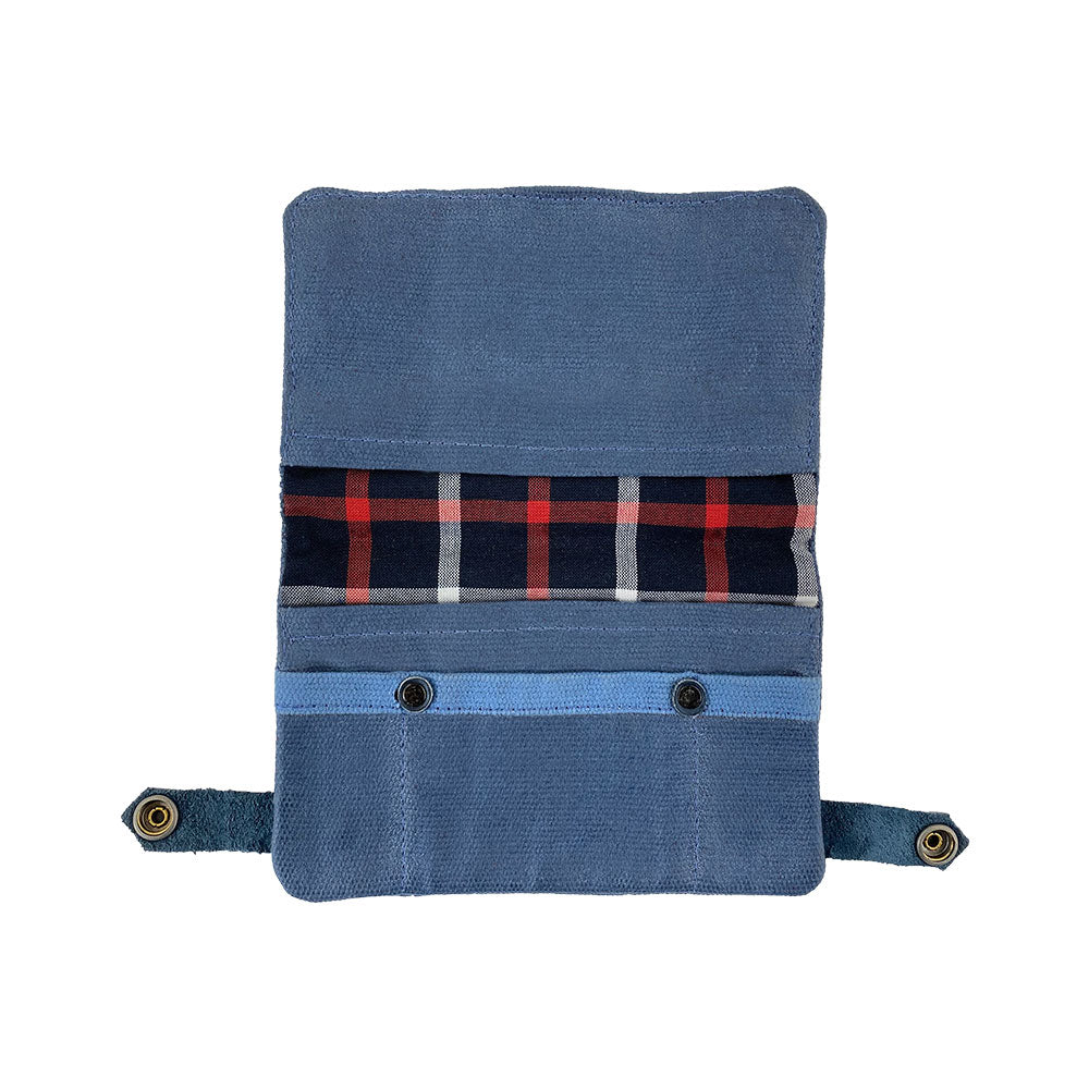 Interior view of the blue Hide & Drink Tobacco Pouch Waxed Canvas featuring plaid cotton lining. This artisan-made pouch offers ample space for tobacco and is a stylish travel essential for organizing field notes.
