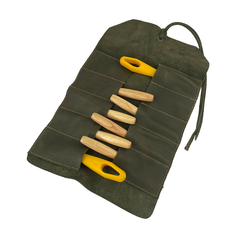 Hide & Drink Tool Roll showcases a stylish small tool roll-up bag with 10 slots, made from resilient full grain leather. Ideal as a portable carry-on pouch for woodworking tools, it supports enhanced workshop storage solutions. Each item is handcrafted in La Antigua Guatemala & Oaxaca Mexico, underlining artisan excellence.