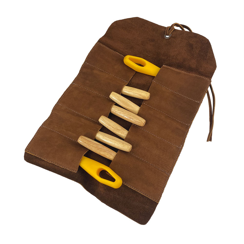 Hide & Drink Tool Roll showcases a chic small tool roll-up bag with 10 slots, constructed from sturdy full grain leather. Ideal as a portable carry-on pouch for organizing woodworking tools, it is your go-to workshop storage solution. Each product is handcrafted in La Antigua Guatemala & Oaxaca Mexico, reflecting exquisite artisan craftsmanship.