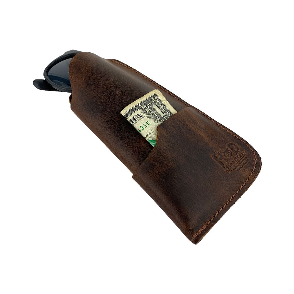Featuring the Hide & Drink Sunglass Case & Wallet, designed as a Rustic Sunglasses Case & Wallet for protection of your eyeglasses. This Full Grain Leather product shows true artisan skills with hand-cut and hand-sewn detailing, made in La Antigua Guatemala & Oaxaca Mexico.