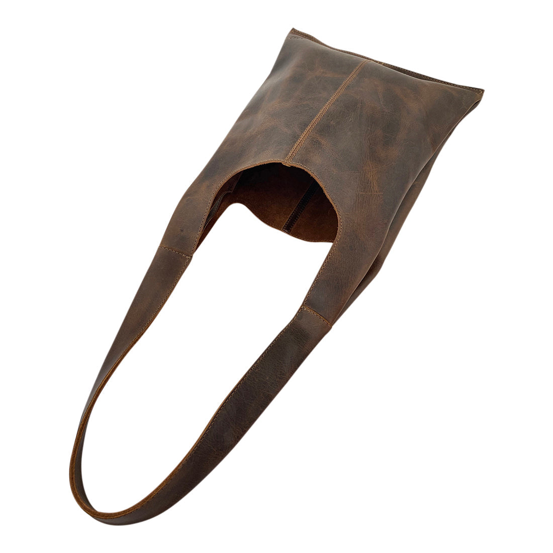 Top view of the Shoulder Bag for Laptop by Hide & Drink, highlighting its unique opening and rustic appearance. This full grain leather bag is designed for a 13-inch laptop, making it great for daily use. Handmade in La Antigua Guatemala.
