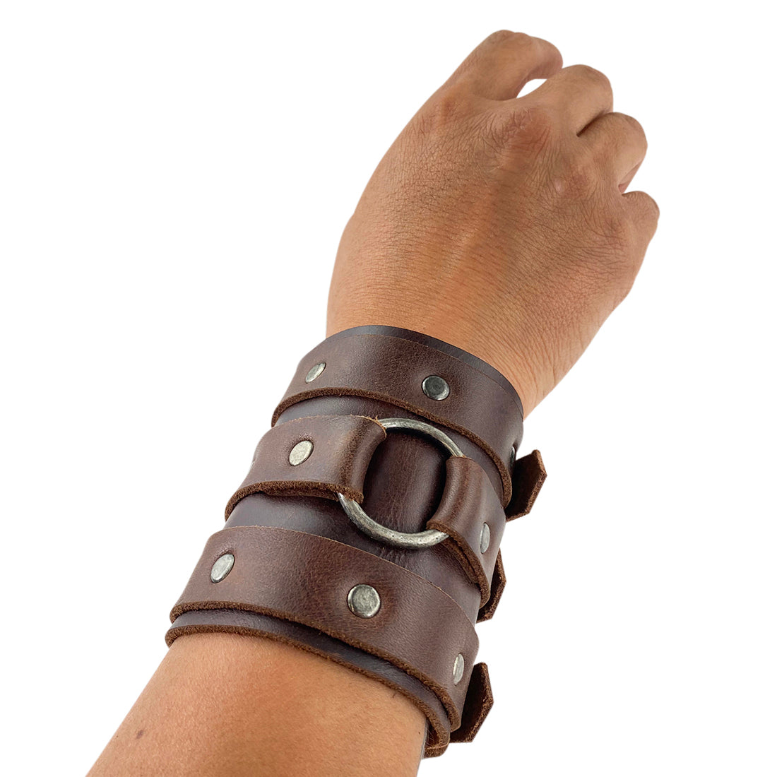A hand modeling the 3 Buckle Bracelet by Hide & Drink, showcasing its fit and style. This trendy men’s fashion accessory features an adjustable cuff made from durable full grain leather, handmade in La Antigua Guatemala & Oaxaca Mexico with care.