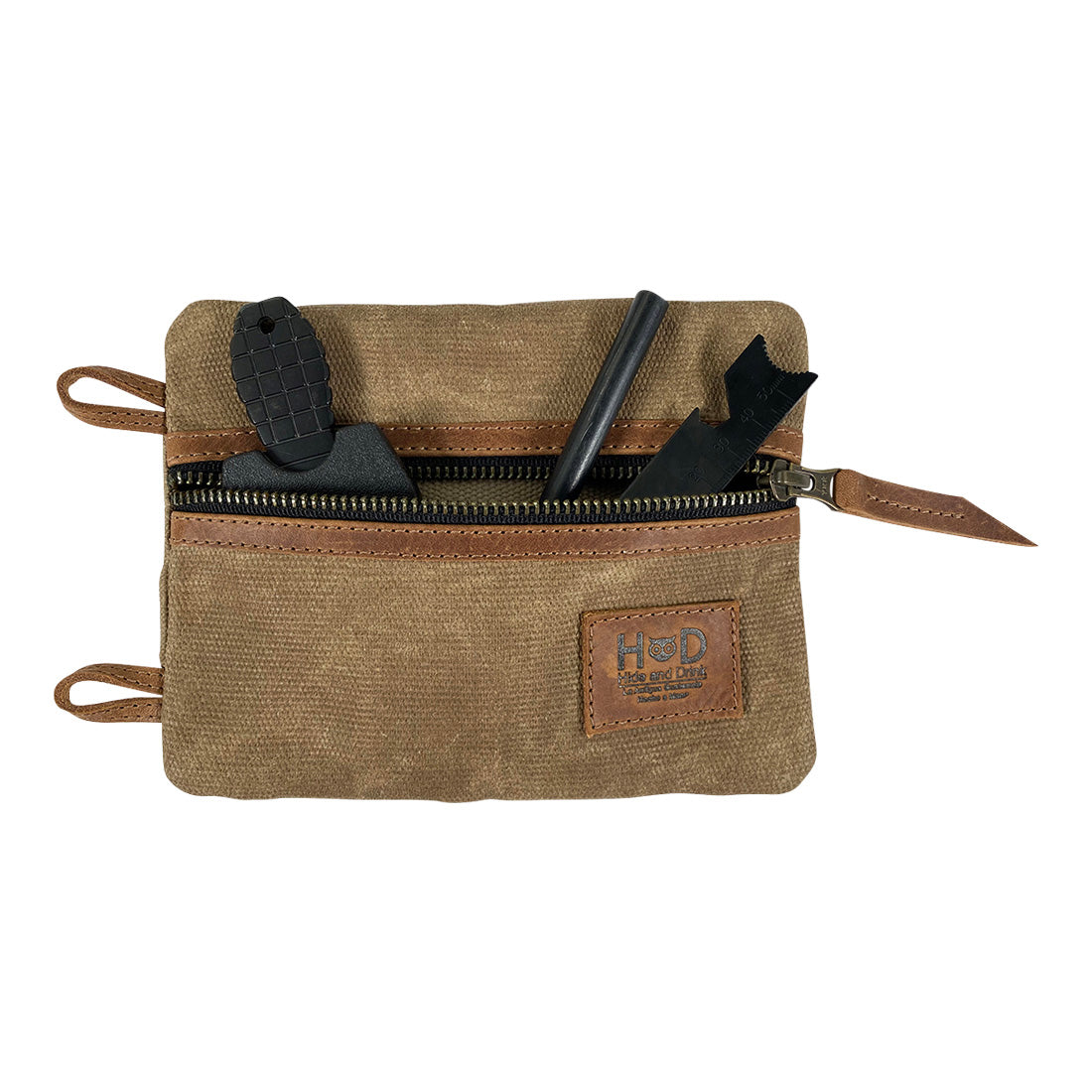 Front view of the Multi-tool Pocket Pouch - XL by Hide & Drink filled with tools, demonstrating its capacity as a mini camping tool case and its practical use for any handyman. Multi-Tool Pocket Pouch XL, Compact Multipurpose EDC Zippered Bag, Knife Holster, Handmade Slim Organizer, Waxed Canvas, StockyardX, Small Batch Production, Hand Cut, Hand Sewn, Artisan, Handmade in La Antigua Guatemala & Oaxaca Mexico.
