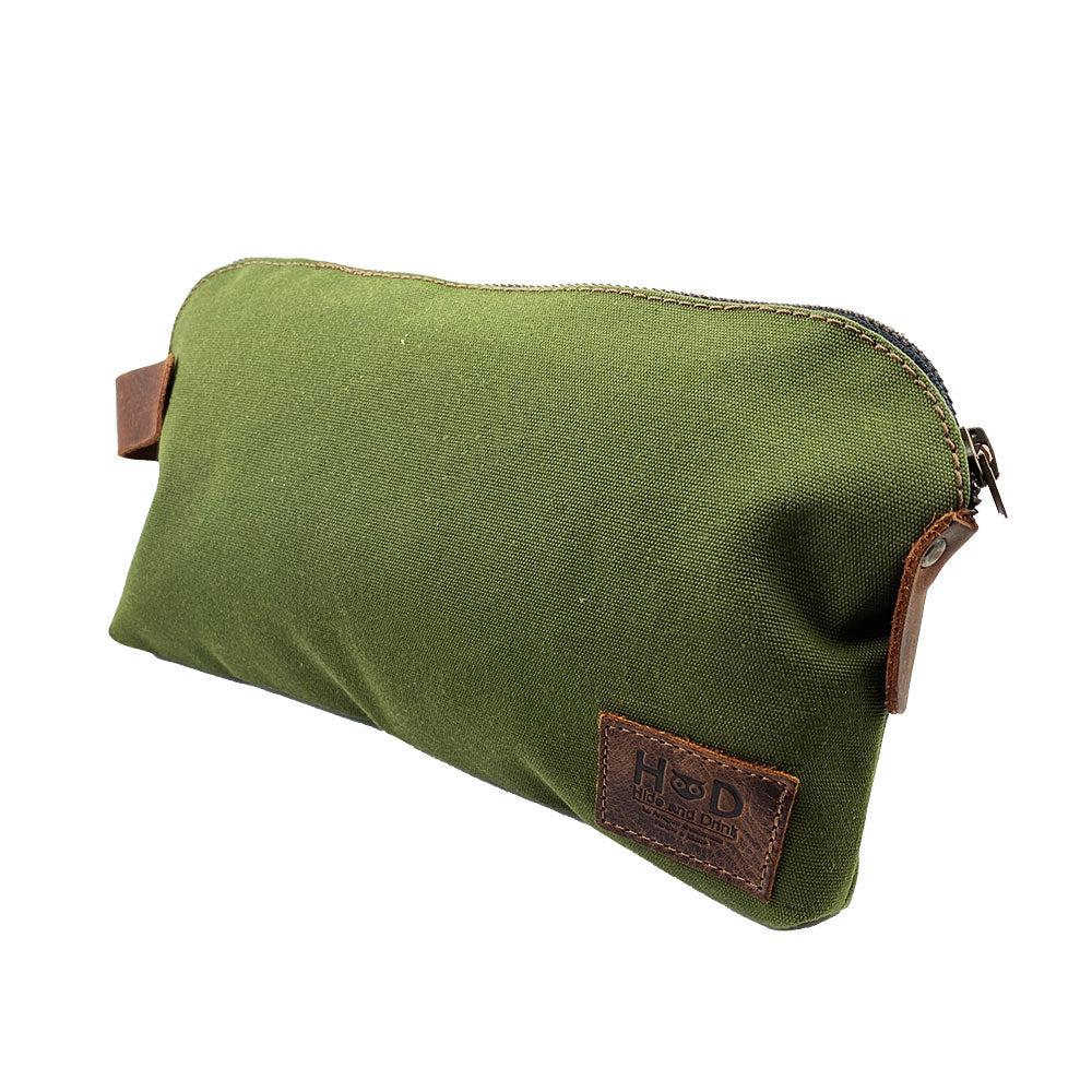 Dopp Kit Utility Bag by Hide & Drink presenting a visually appealing design and robust utility. This artisan Dopp Kit Utility Bag is made from full grain leather and emphasizes the artisan techniques of hand cut and hand sewn craftsmanship in small batch production, handmade in La Antigua Guatemala & Oaxaca Mexico.