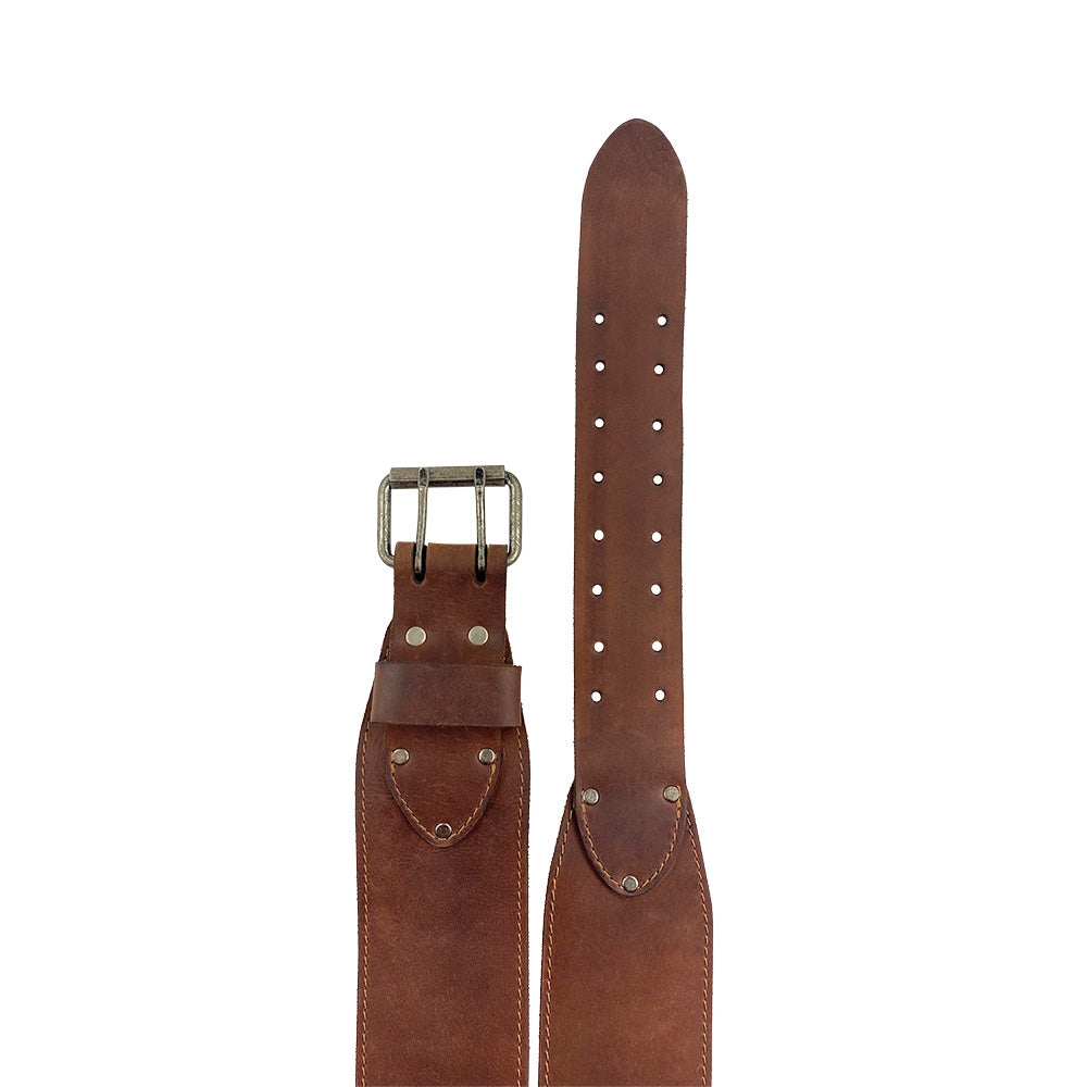 Close-up of Hide & Drink’s Weightlifting Belt featuring a strong double prong buckle. This weightlifting belt measures 3 in. wide and is suitable for waist sizes 31 in. to 38 in. Crafted with care, it embodies artisan quality and durability in full grain leather from La Antigua Guatemala & Oaxaca Mexico.
