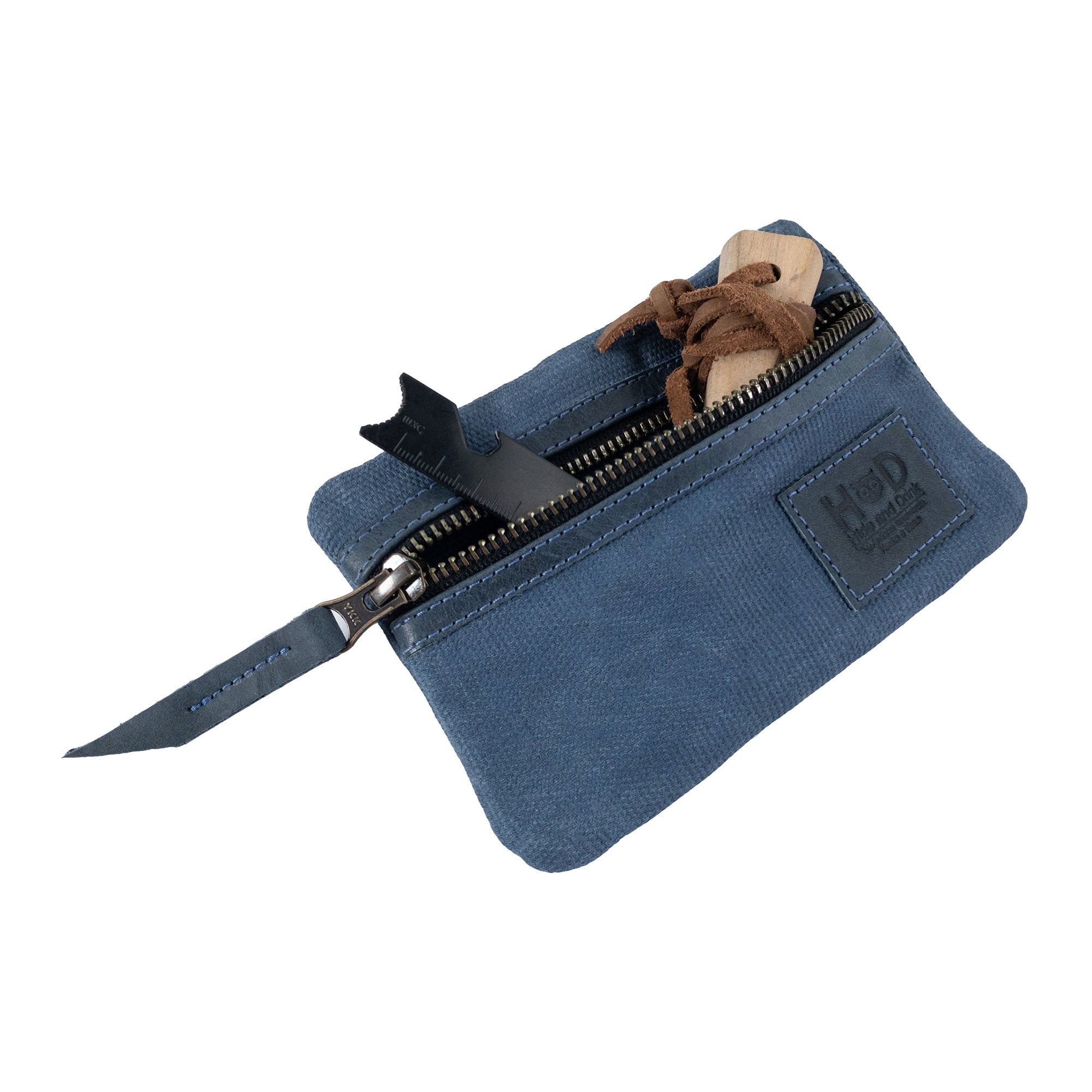 Open green Multi-tool Pocket Pouch by Hide & Drink, featuring handy storage options for everyday carry items.