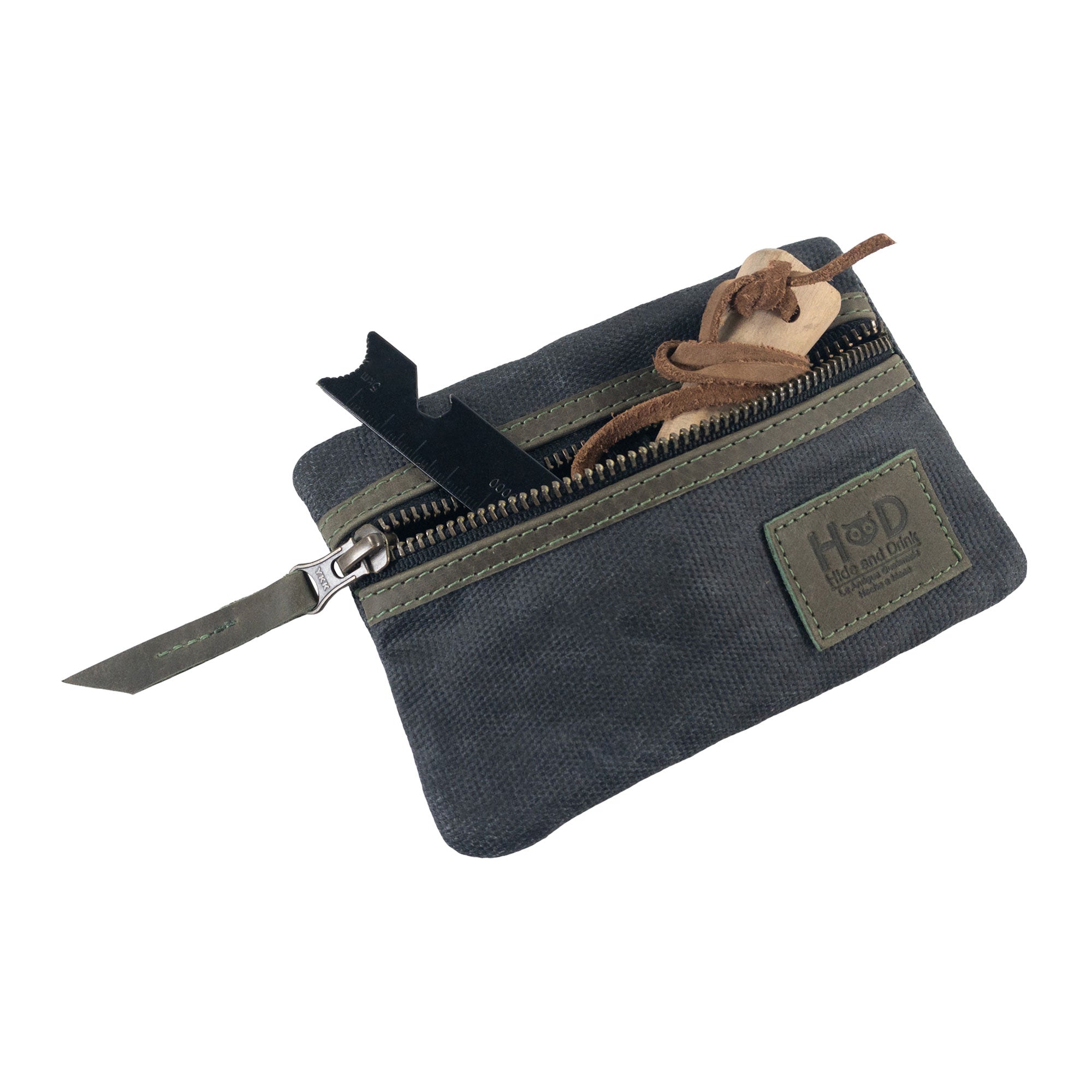 Open navy Multi-tool Pocket Pouch by Hide & Drink, displaying compartments for versatile tool storage.