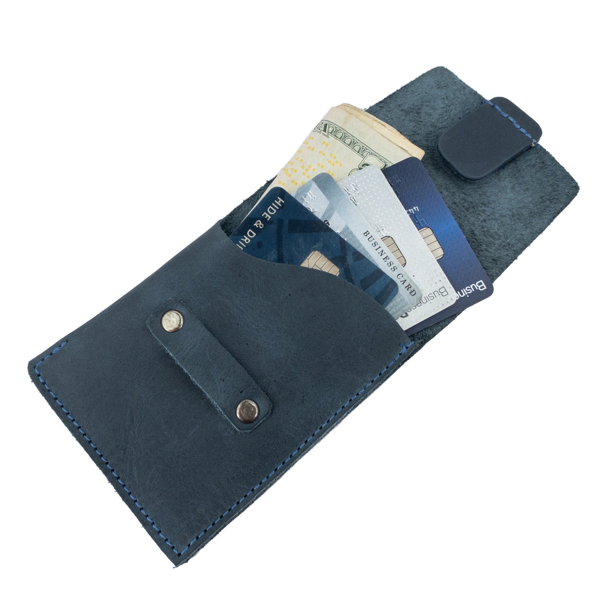 Hide & Drink Slim Card Holder with cards and cash visible, showcasing the practicality of holding up to 4 cards. This full grain leather wallet is designed for easy access, handmade in La Antigua Guatemala with artisan craftsmanship.