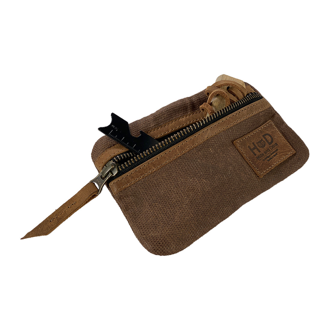 Open brown Multi-tool Pocket Pouch by Hide & Drink, highlighting its internal layout, ideal for storing EDC tools in a slim profile.