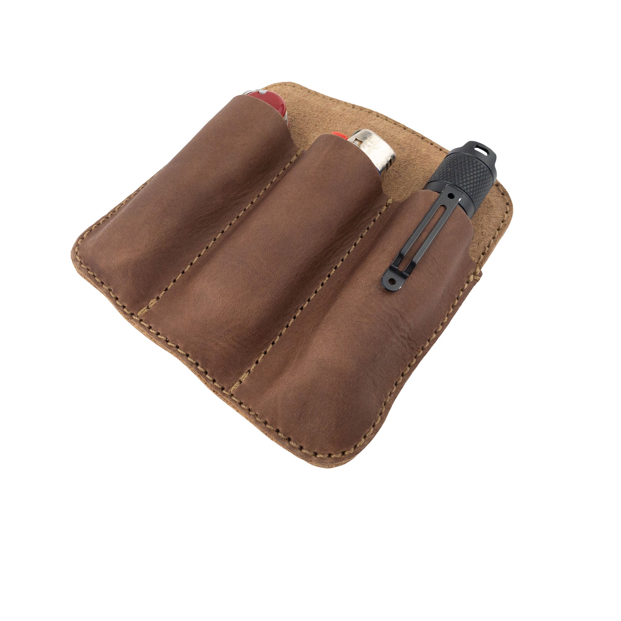 View of Hide & Drink Minimalist Tool Pocket displayed with everyday items. Handmade from Full Grain Leather, this Tool Pocket Pouch embodies artisan skills from La Antigua Guatemala and aligns with StockyardX’s small batch production philosophy.