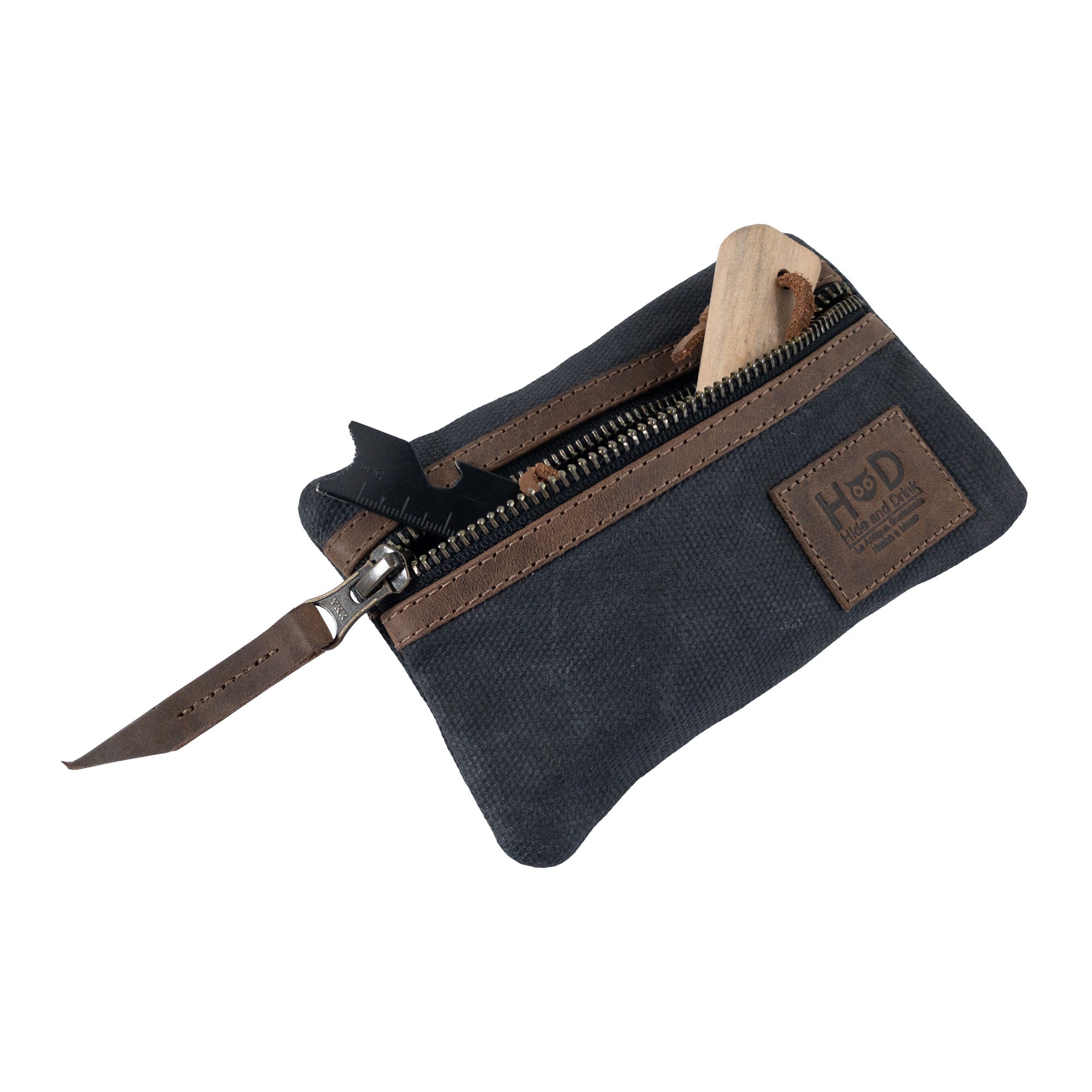 Open red Multi-tool Pocket Pouch by Hide & Drink, displaying its well-designed internal compartments for storage.