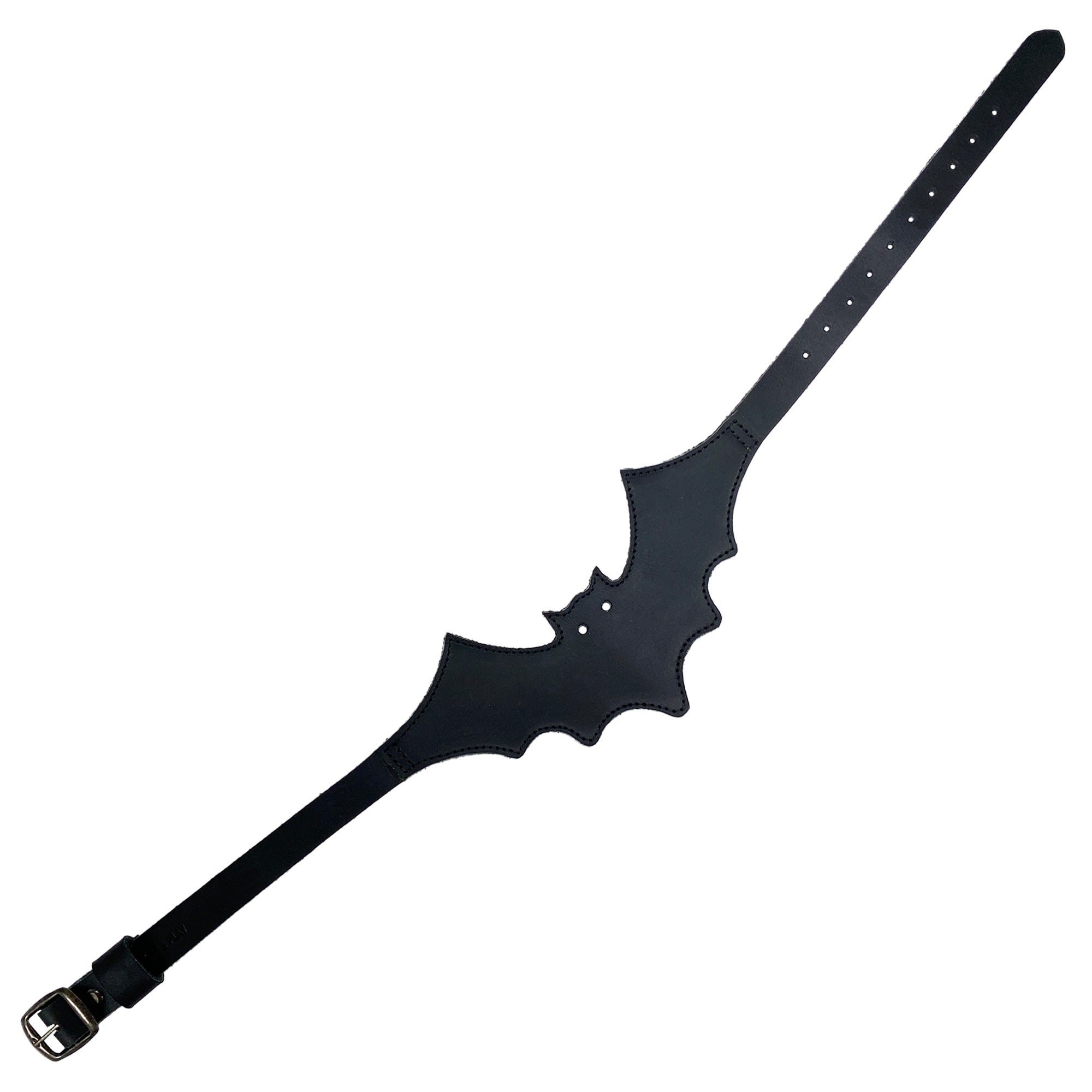 Flat lay of the Bat-man Choker by Hide & Play, emphasizing its unique bat shape and adjustable strap. This stylish Bat Choker is a soft and durable collar crafted with artisanal techniques, great for a punk style look.
