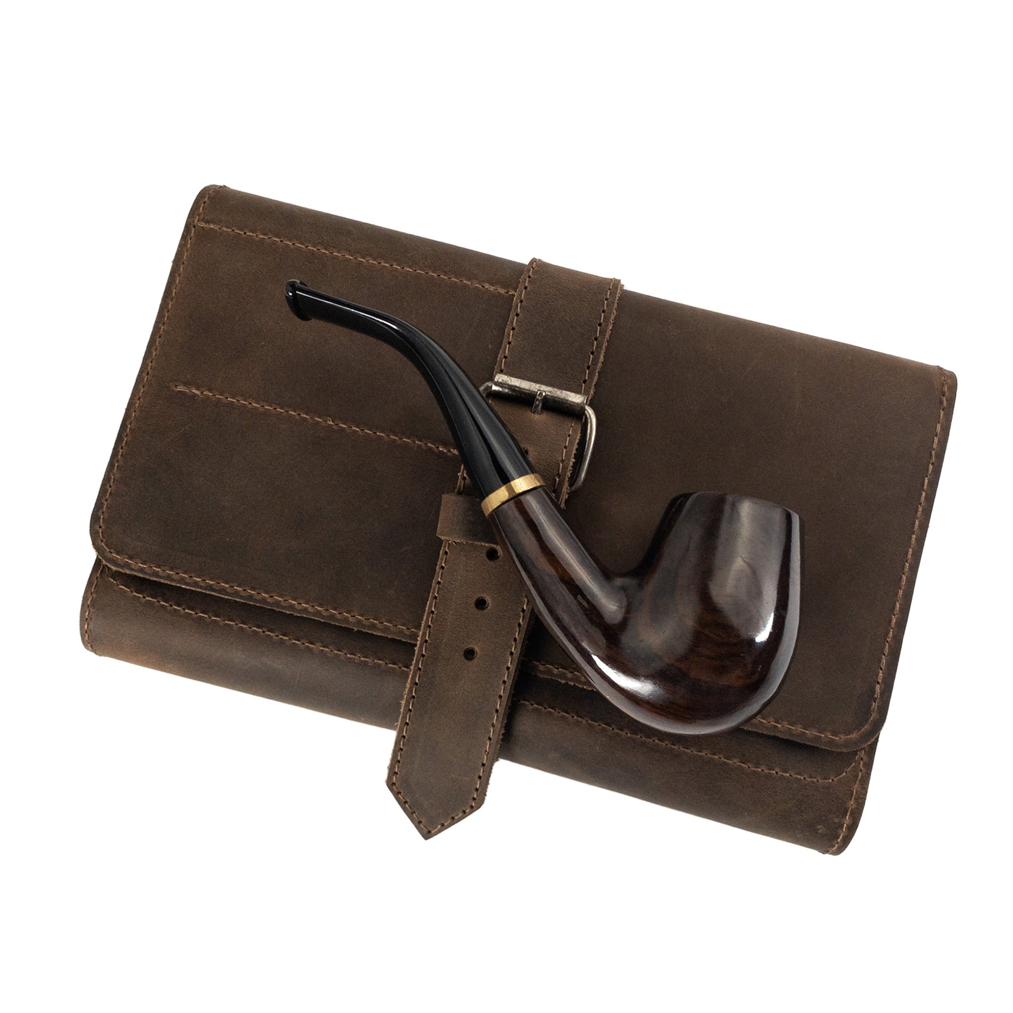 Pipe resting on the brown Hide & Drink Double Pipe Tobacco Pouch, showcasing its rustic design and Full Grain Leather. Ideal for storing your tobacco and accessories, made by artisan craftsmen.