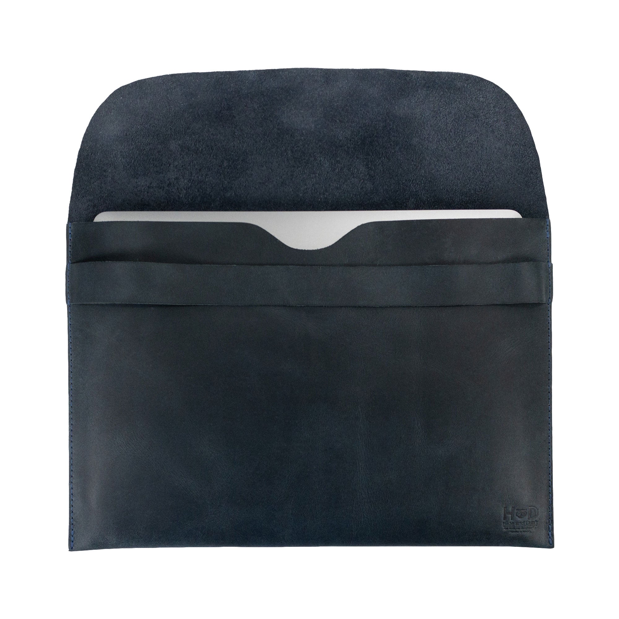 Open interior view of the black Hide & Drink MacBook Slim Case, emphasizing its soft lining. This case is designed for MacBook Air/Pro 13 Inch with M1 Chip, highlighting artisan craftsmanship through hand cut and hand sewn techniques in full grain leather.