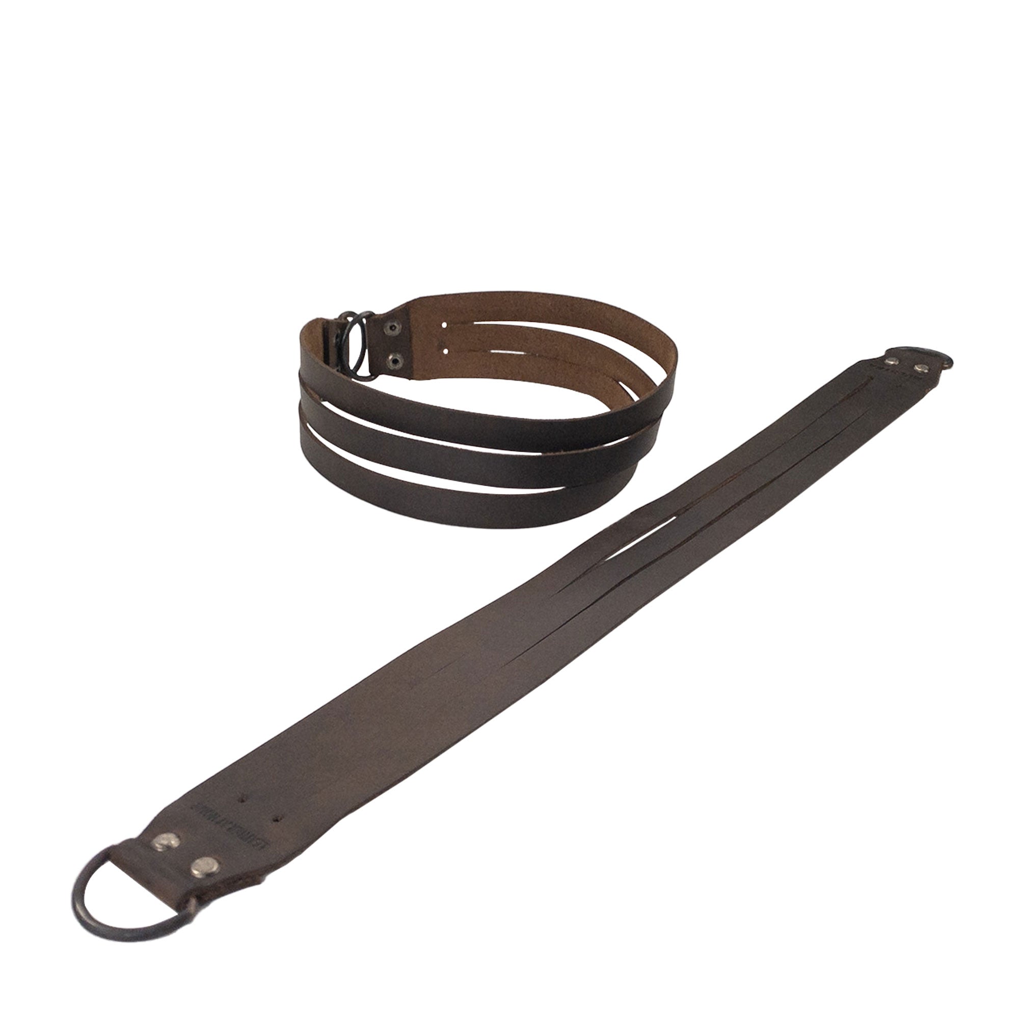 Stylish Curtain Tie Back with Half Ring (2 Pack) featuring both dark and light brown Full Grain Leather by Leather At Home. Made using small batch production techniques and expertly hand cut, hand sewn, and fire branded, this artisan good is handmade in La Antigua Guatemala & Oaxaca Mexico.