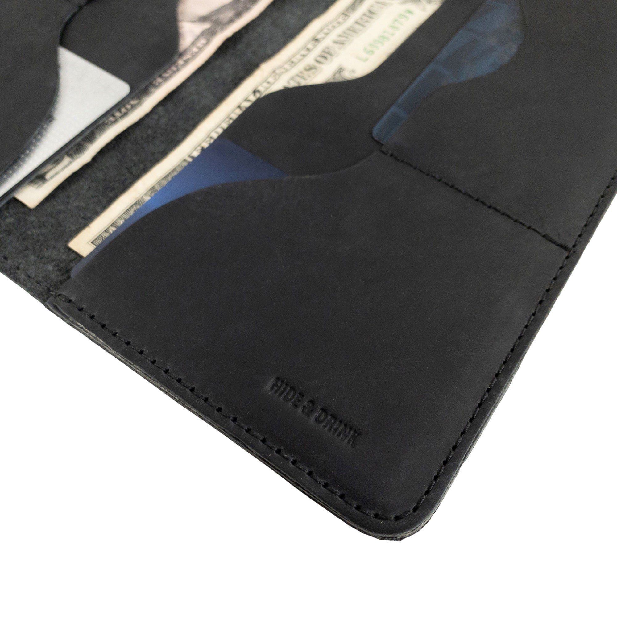 Hide & Drink Large Organizer Wallet focusing on its elegant design and multi-functional features. This artisan bifold wallet, made from quality full grain leather, serves as a reliable travel accessory, crafted in La Antigua Guatemala & Oaxaca Mexico.