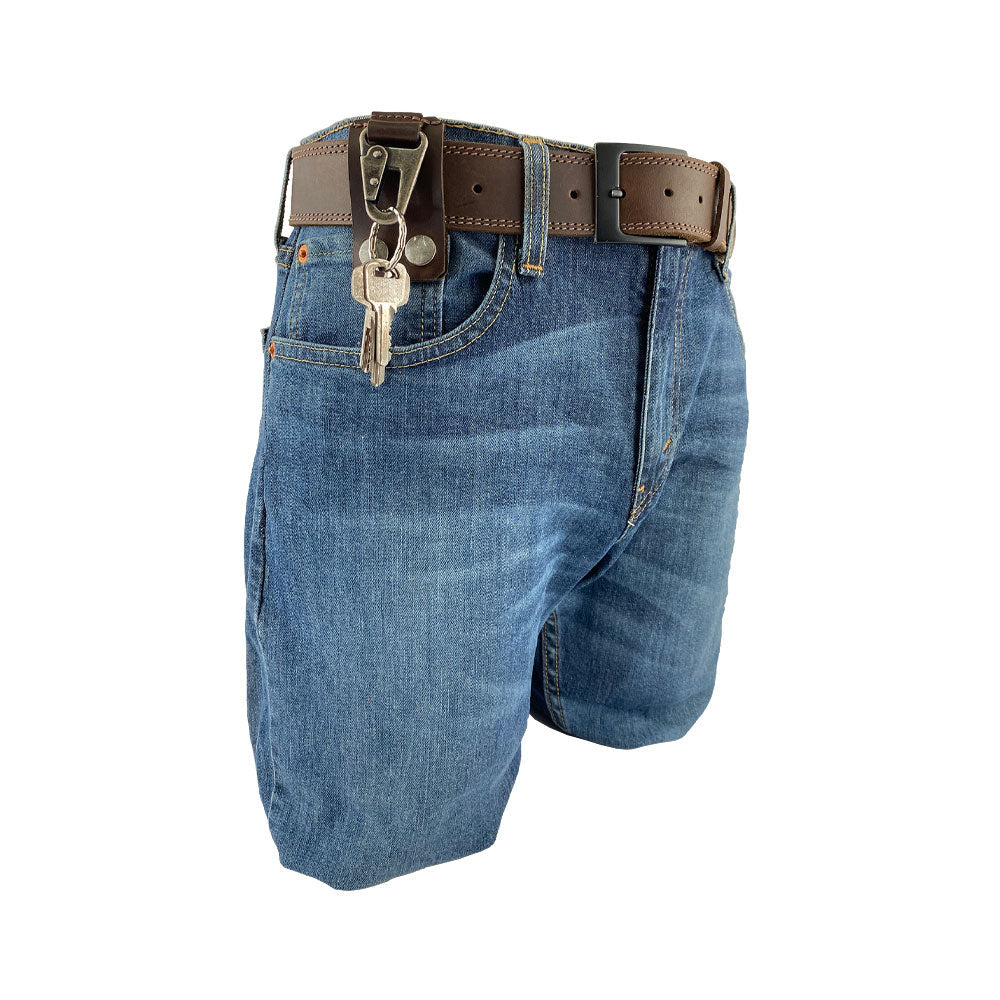 Belt Keychain Holder Hook by Hide & Drink attached to jeans, demonstrating its functional style as a belt clip key chain holder hook. Made from thick full grain leather, this artisan product is handmade in La Antigua Guatemala & Oaxaca Mexico, reflecting small batch production standards.
