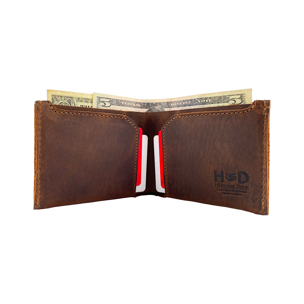 Inside view of the Hide & Drink Classic Wallet with cards and cash, highlighting its practical use as a card organizer and money holder. Classic Wallet, Card Organizer, Money Holder, Vintage Pocket, Travel Accessories, Full Grain Leather, StockyardX, Small Batch Production, Hand Cut, Hand Sewn, Fire Branded, Artisan, Handmade in La Antigua Guatemala & Oaxaca Mexico.