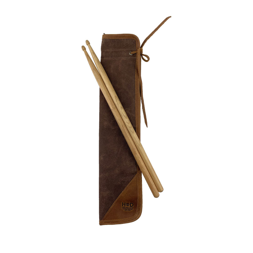 Close-up of the brown Hide & Drink Drummstick Bag showing its durable construction and design. This Waxed Canvas & Full Grain Leather Drumstick Bag Holder is a perfect accessory for musicians, highlighting the craftsmanship of small batch production from La Antigua Guatemala & Oaxaca Mexico.