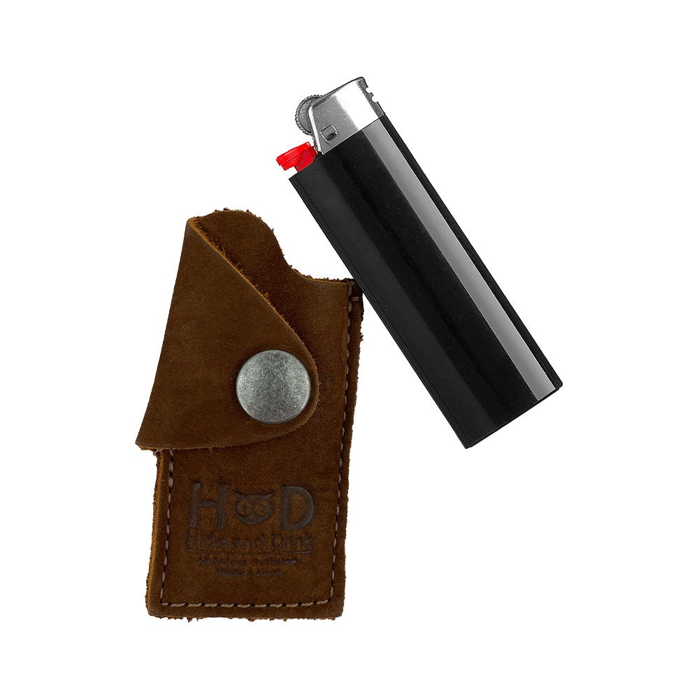 Close-up of the black Hide & Drink Lighter Protective Case, showing the premium full grain leather and artisan hand-sewn details. This case is crafted in La Antigua Guatemala & Oaxaca Mexico with precision. Keywords include: Lighter Protective Case, Full Grain Leather, StockyardX.