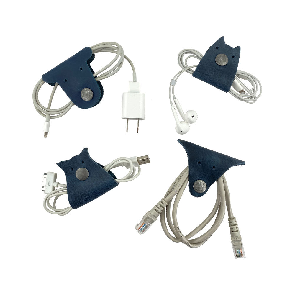 Furry Friends Cord Keeper (4-Pack) with charming designs to manage cords, expertly crafted from full grain leather by Hide & Drink. Furry Friends 4-Pack Cord Keeper (Cord Clam), Full Grain Leather, StockyardX, Small Batch Production, Hand Cut, Hand Sewn, Fire Branded, Artisan, Handmade in La Antigua Guatemala & Oaxaca Mexico.