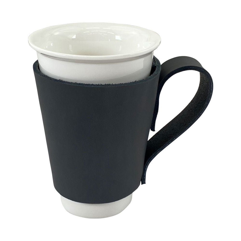 Elegant Pint Sleeve with Handle by Hide & Drink, combining functionality and design made from Full Grain Leather. This artisan creation is Hand Sewn and Fire Branded, perfect for keeping drinks cool in any bar setting.