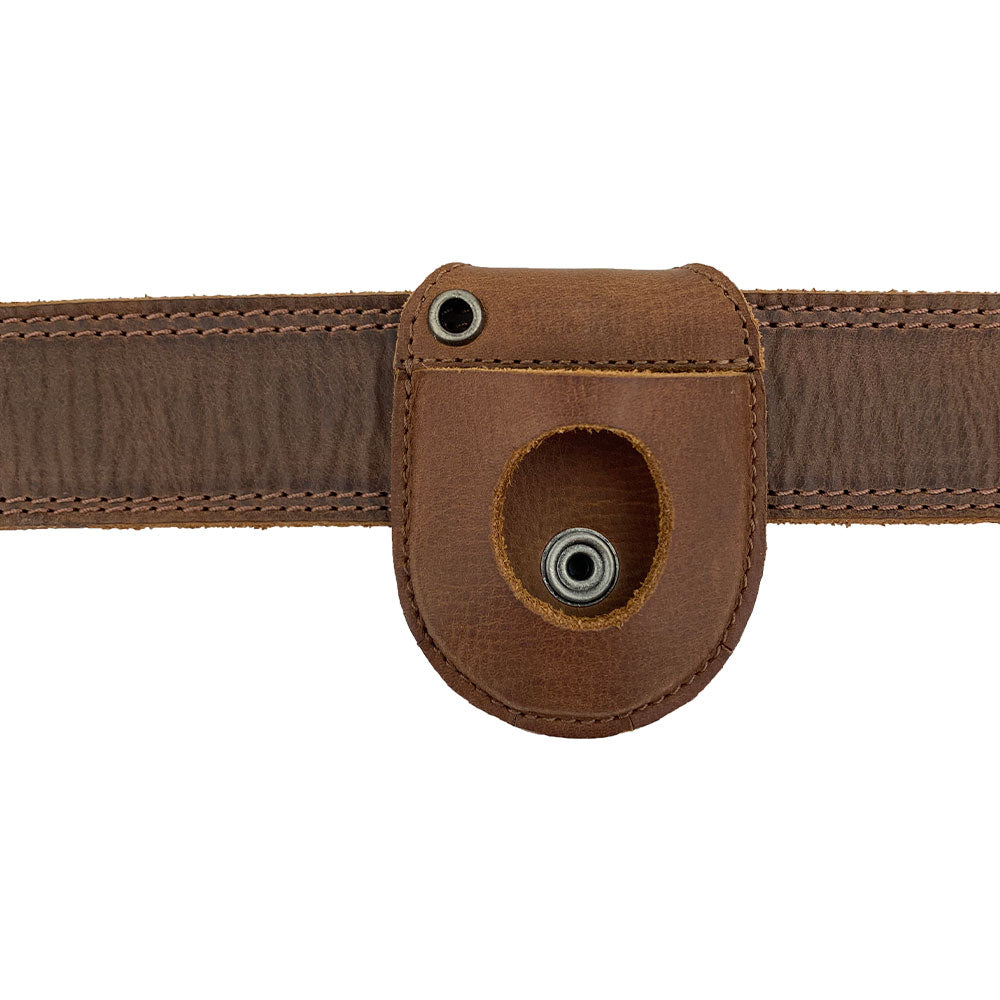 Hide & Drink Pocket Watch Holder and Case attached to a belt, demonstrating its practical use for timepiece protection. This pocket watch case serves as a rustic protector holder made from full grain leather, highlighting small batch production, hand cut, hand sewn, and artisan quality. Handmade in La Antigua Guatemala & Oaxaca Mexico.