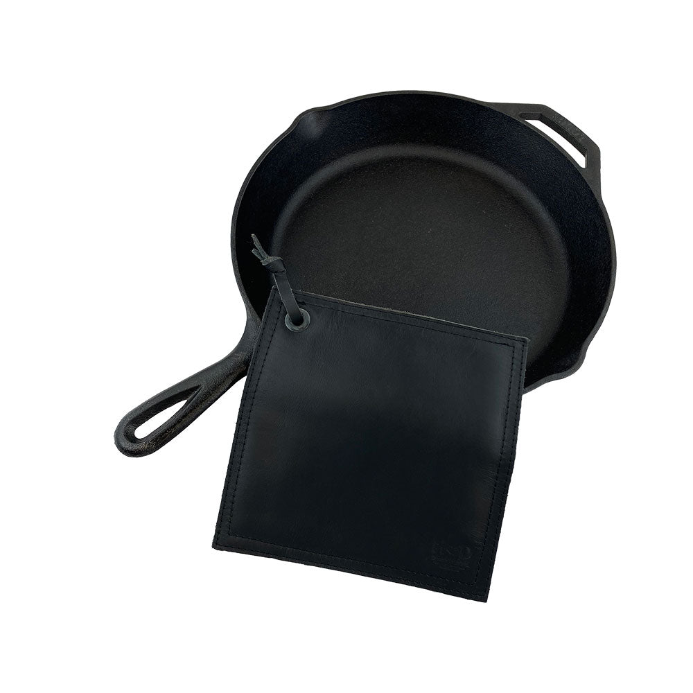 Hide & Drink Pot Pad featuring dimensions on display, highlighting its practical use in the kitchen. This handcrafted double-layered pot holder is perfect for hot pans.