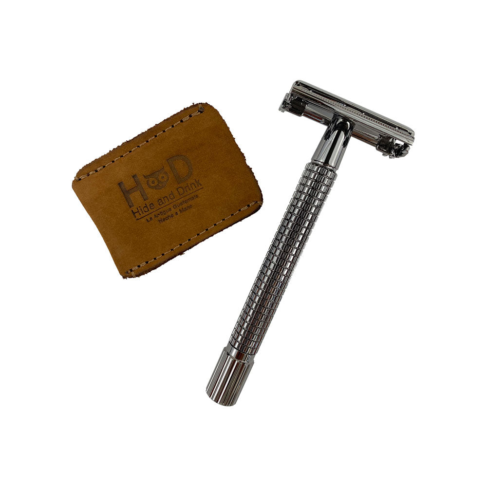 Hide & Drink Razor Head Cover with the razor alongside, highlighting the full grain leather design. This razor head cover serves as a protective sheath, perfect for travel, crafted by artisans in La Antigua Guatemala.