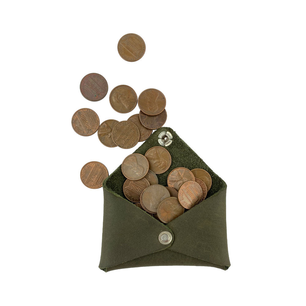Hide & Drink Envelope Coin Case filled with coins, illustrating its practicality and charming design. Made from high-quality full grain leather, this artisan piece is handcrafted in La Antigua Guatemala & Oaxaca Mexico.