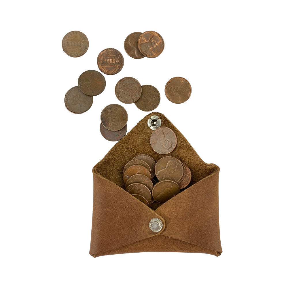Hide & Drink Envelope Coin Case filled with coins, showcasing its practicality and stylish design. Made from high-quality full grain leather, this artisan item is handmade in La Antigua Guatemala & Oaxaca Mexico.