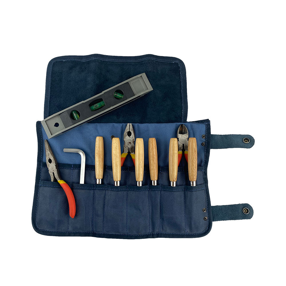 Hide & Drink's Barber Tool Roll presents a Snap Tool Roll Up Bag with 14 Slots designed for efficient storage of scissors & screwdrivers. This portable carry case, made from durable Full Grain Leather, highlights StockyardX's artisan craftsmanship and dedication to small batch production, hand cut, hand sewn, and fire branded in La Antigua Guatemala & Oaxaca Mexico.