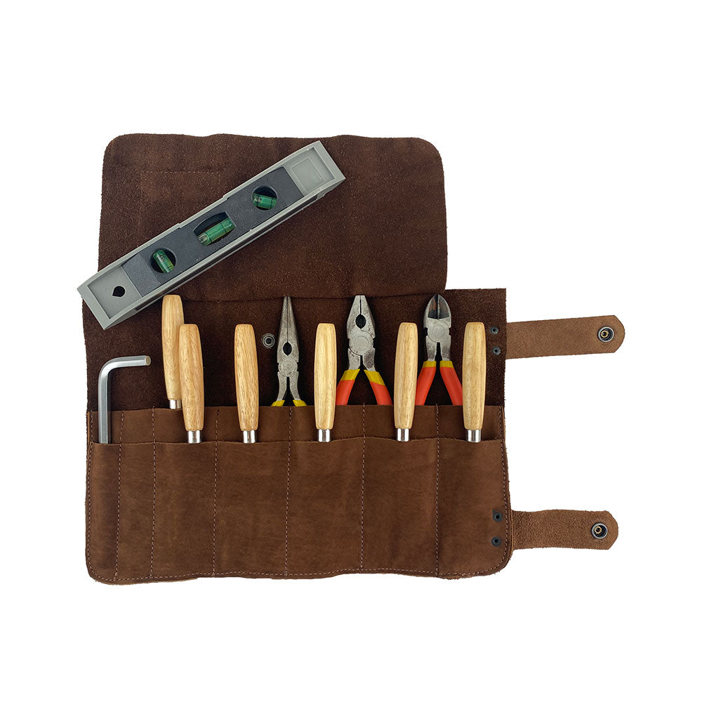 Hide & Drink presents the Barber Tool Roll, showcasing a Snap Tool Roll Up Bag with 14 Slots. Ideal for organizing your scissors & screwdrivers, this portable carry case is crafted from full grain leather. StockyardX emphasizes small batch production, combined with artisan skills, as it's hand cut, hand sewn, and fire branded in La Antigua Guatemala & Oaxaca Mexico.
