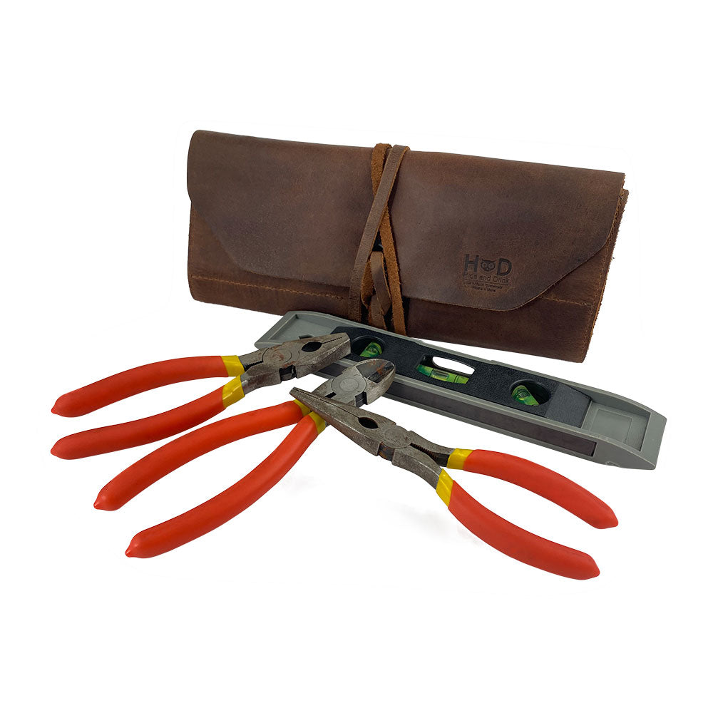 Hide & Drink Tool Roll features a dedicated small tool roll-up bag with 10 slots made from robust full grain leather. Ideal as a portable carry-on pouch for your woodworking tools, it enhances your workshop storage experience. Hand cut and sewn, this artisan item underscores quality craftsmanship from La Antigua Guatemala & Oaxaca Mexico.