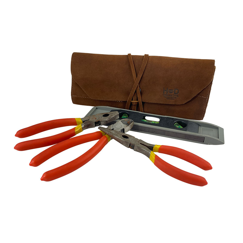 Hide & Drink Tool Roll features a classic small tool roll-up bag with 10 slots, designed in high-quality full grain leather. This portable carry-on pouch makes a perfect woodworking tools organizer, fitting seamlessly into your workshop storage toolkit. Each item is hand sewn and cut, showcasing artisan quality from La Antigua Guatemala & Oaxaca Mexico.