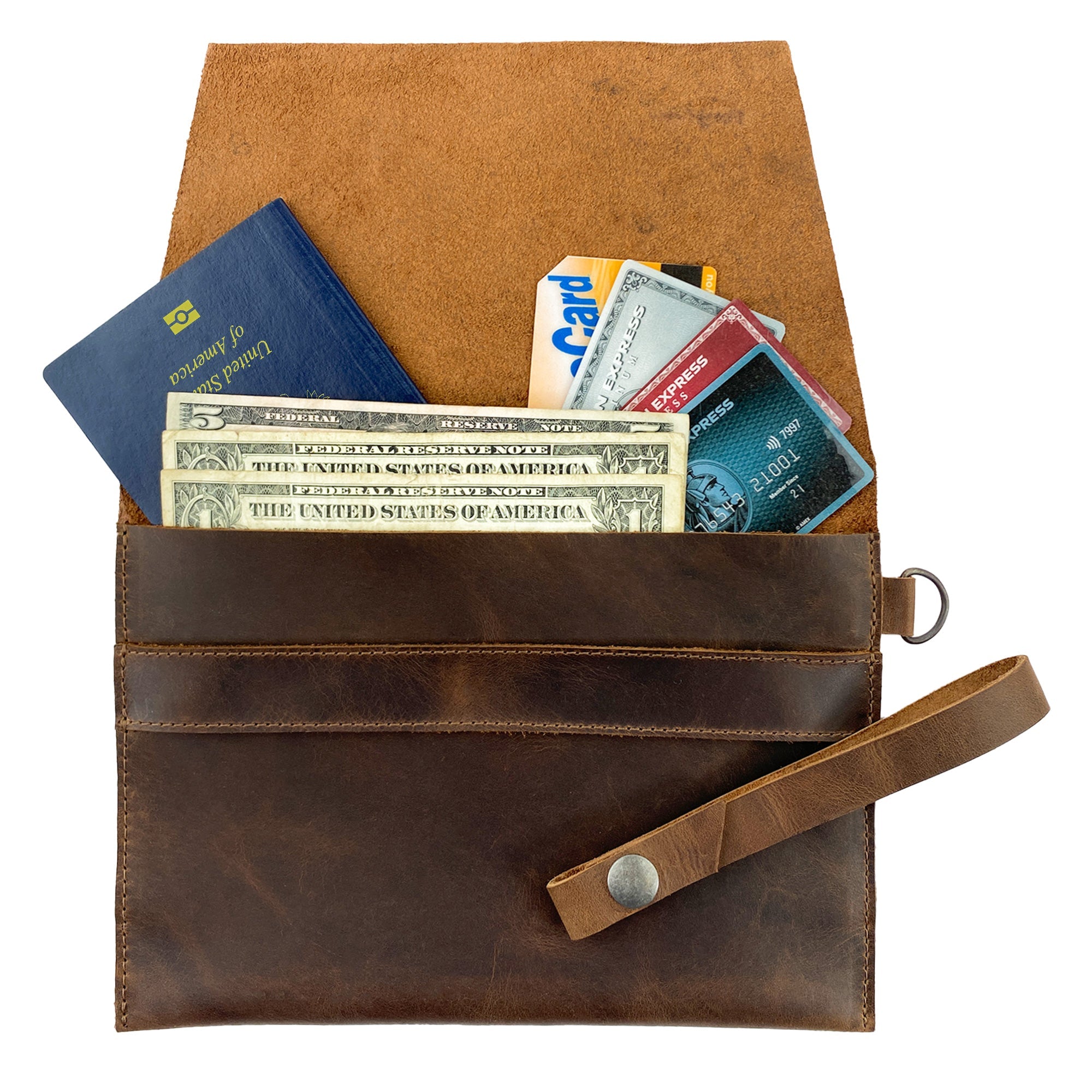 Interior view of Heather's Vintage Clutch Bag filled with essentials, showcasing its role as a wrist wallet for cards and money. Made with exquisite full grain leather, this handmade bag is a product of small batch production techniques from La Antigua Guatemala & Oaxaca Mexico.
